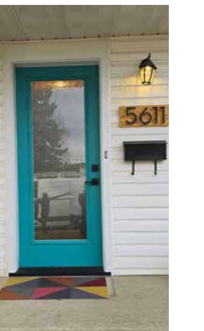 Painted teal entry door with full glass insert