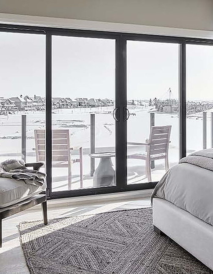 Sliding patio door opening to a lakeside deck