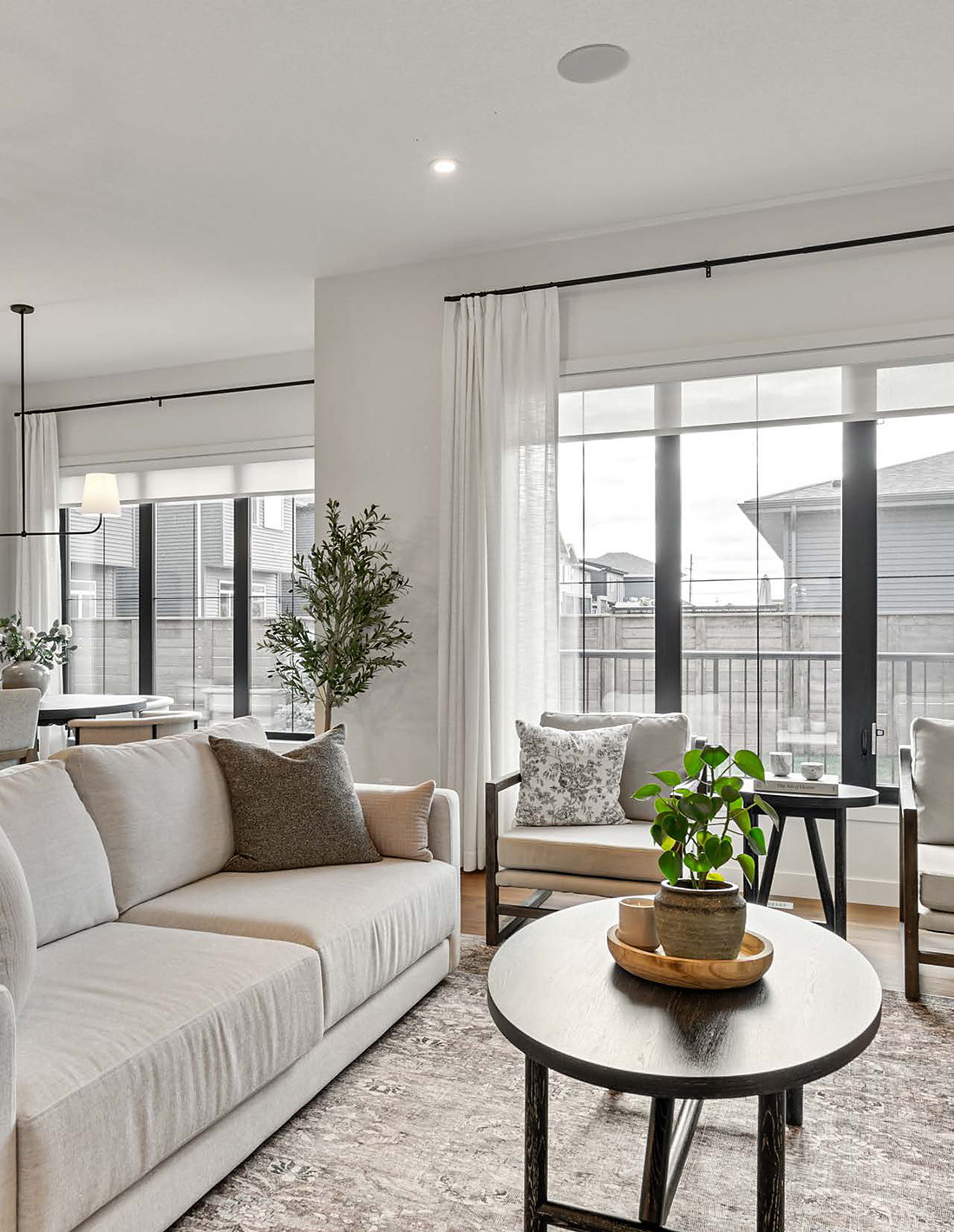 Living room with tall Durabuilt windows and soft drapery